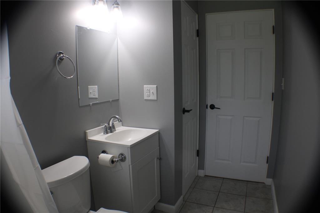 312 Cherokee Drive Butler, PA 16001 - Photo 18 of 40 a bathroom with a sink toilet and mirror