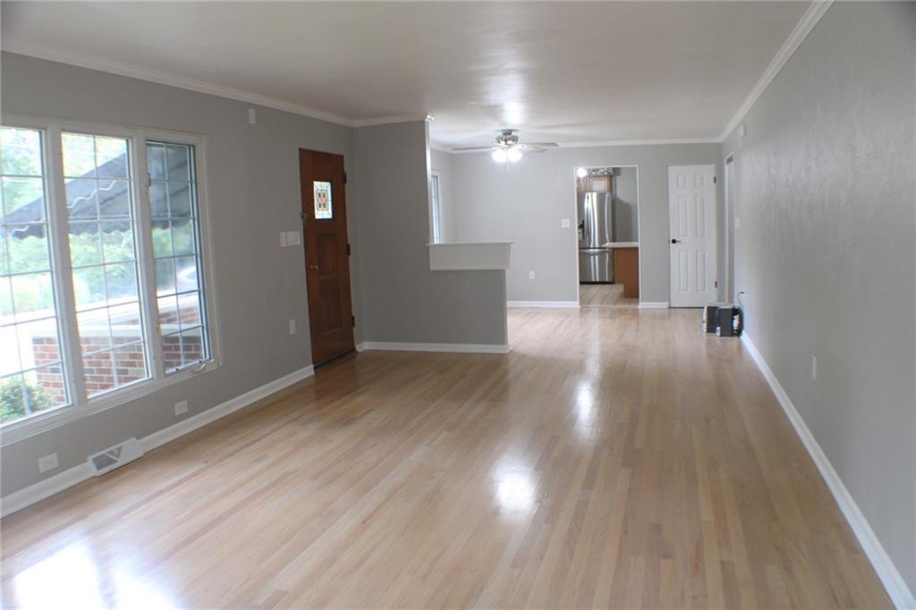 312 Cherokee Drive Butler, PA 16001 - Photo 19 of 40 a view of a big room with wooden floor and windows