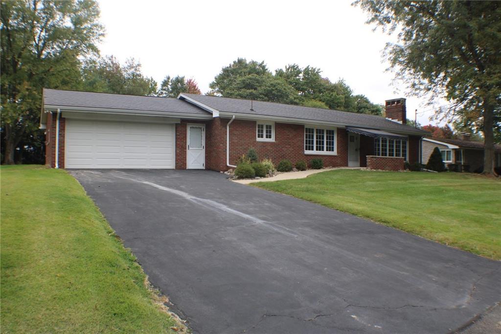 312 Cherokee Drive Butler, PA 16001 - Photo 2 of 40 a front view of a house with yard and trees