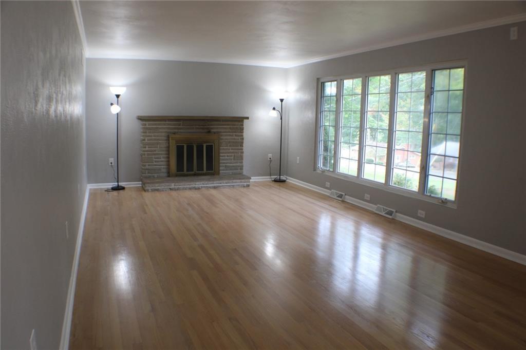 312 Cherokee Drive Butler, PA 16001 - Photo 23 of 40 an empty room with wooden floor and fireplace