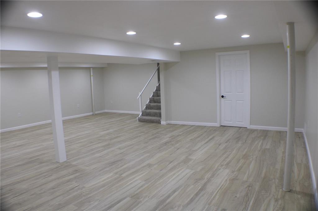 312 Cherokee Drive Butler, PA 16001 - Photo 28 of 40 an empty room with wooden floor and entryway