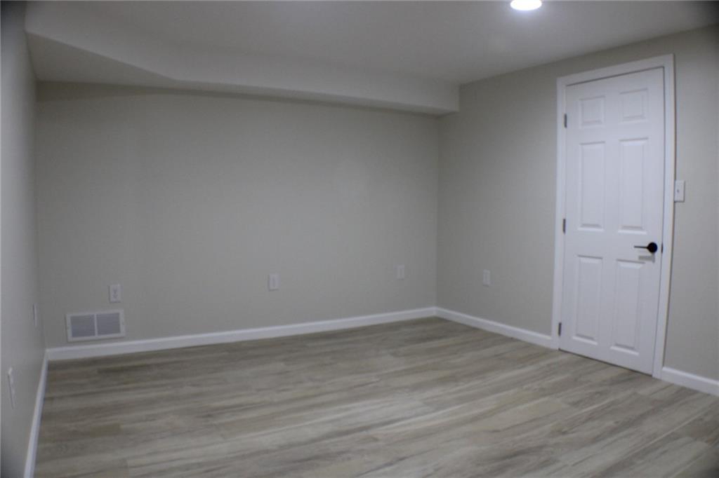 312 Cherokee Drive Butler, PA 16001 - Photo 32 of 40 a view of an empty room with wooden floor