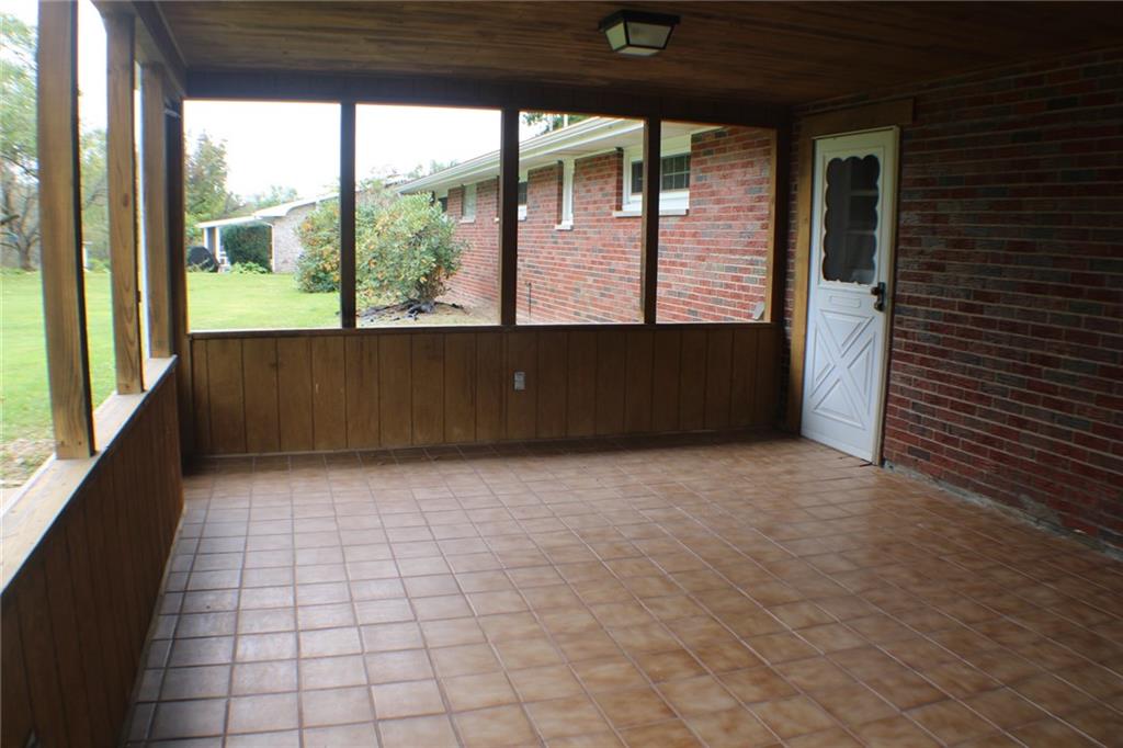 312 Cherokee Drive Butler, PA 16001 - Photo 33 of 40 a view of a porch with wooden floor and stairs