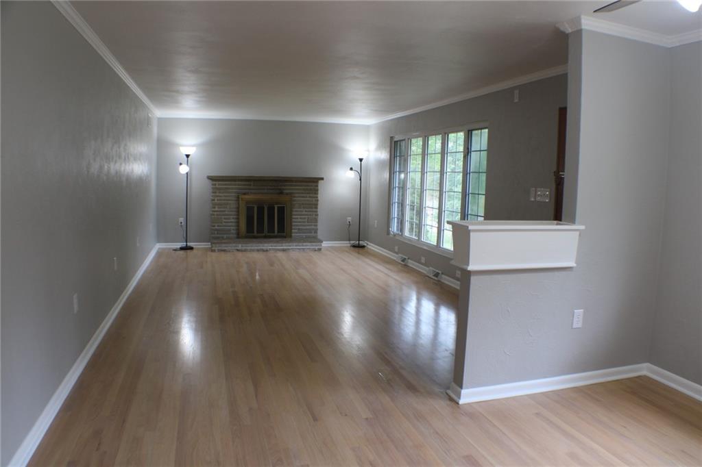 312 Cherokee Drive Butler, PA 16001 - Photo 4 of 40 a view of a livingroom with wooden floor and a fireplace