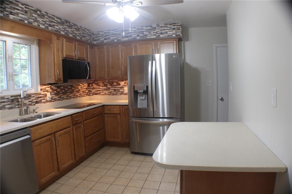 312 Cherokee Drive Butler, PA 16001 - Photo 8 of 40 a kitchen with a sink appliances and cabinets