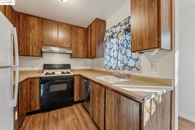a kitchen with a stove and a sink