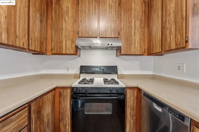 a kitchen with a stove and a sink