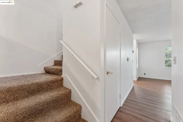 a view of a hallway view with staircase