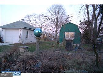 505 South Warwick Road Magnolia, NJ 08049 - Photo 7 of 9 a front view of a house with garden
