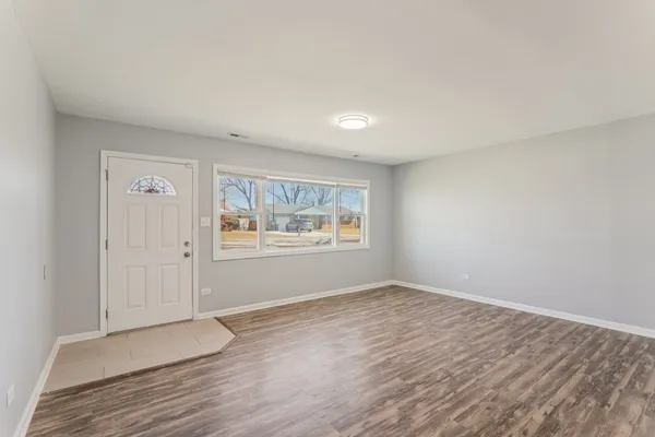 a view of an empty room and window