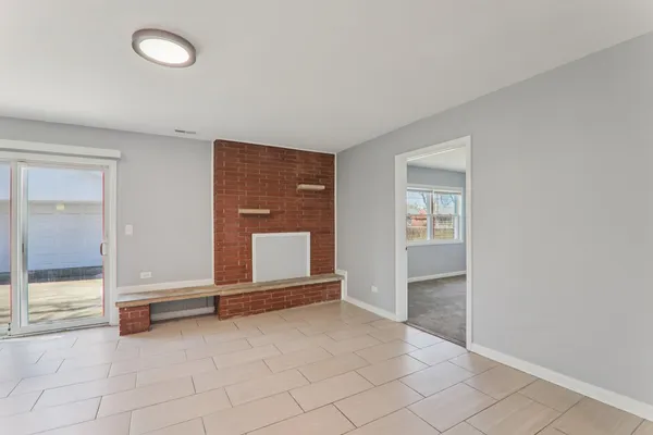 a kitchen with refrigerator and cabinets