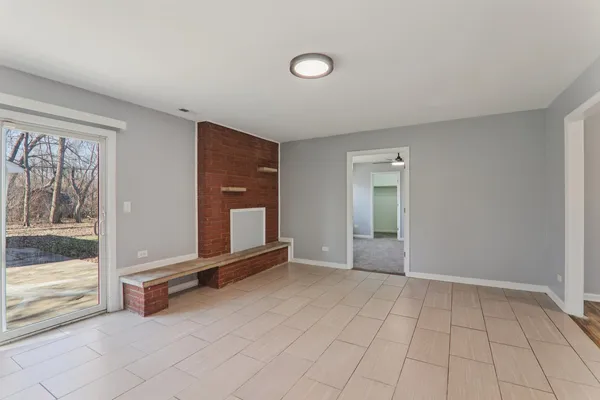 a kitchen with a sink a refrigerator and cabinets