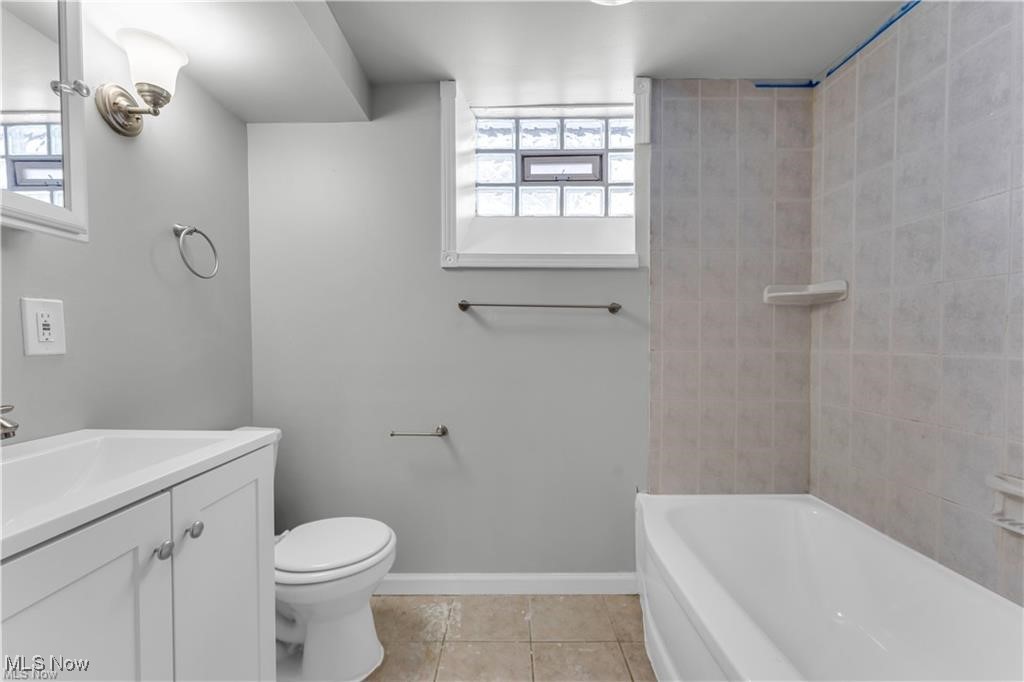 19600 Ridgewood Avenue Beachwood, OH 44122 - Photo 12 of 12 Full bathroom with vanity, toilet, tiled shower / bath, and tile patterned flooring