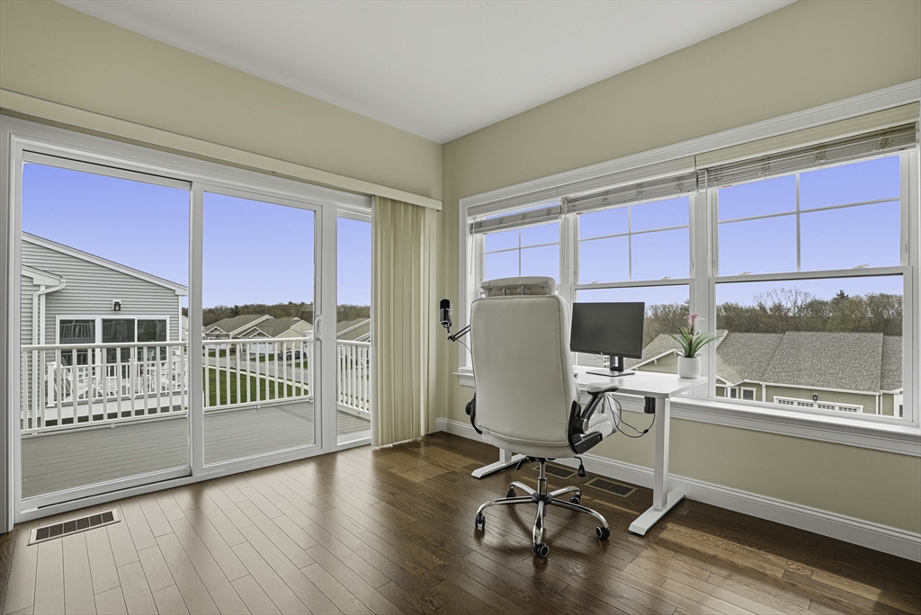 52 Logans Run, Unit 52 Millbury, MA 01527 - Photo 22 of 41 a view of a kitchen with workspace and windows