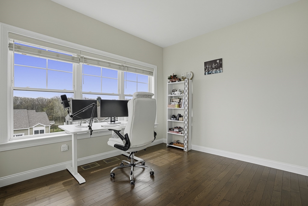 52 Logans Run, Unit 52 Millbury, MA 01527 - Photo 23 of 41 a view of a workspace with furniture and a window