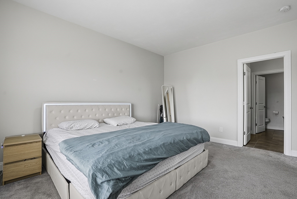 52 Logans Run, Unit 52 Millbury, MA 01527 - Photo 26 of 41 a bedroom with a bed and a window
