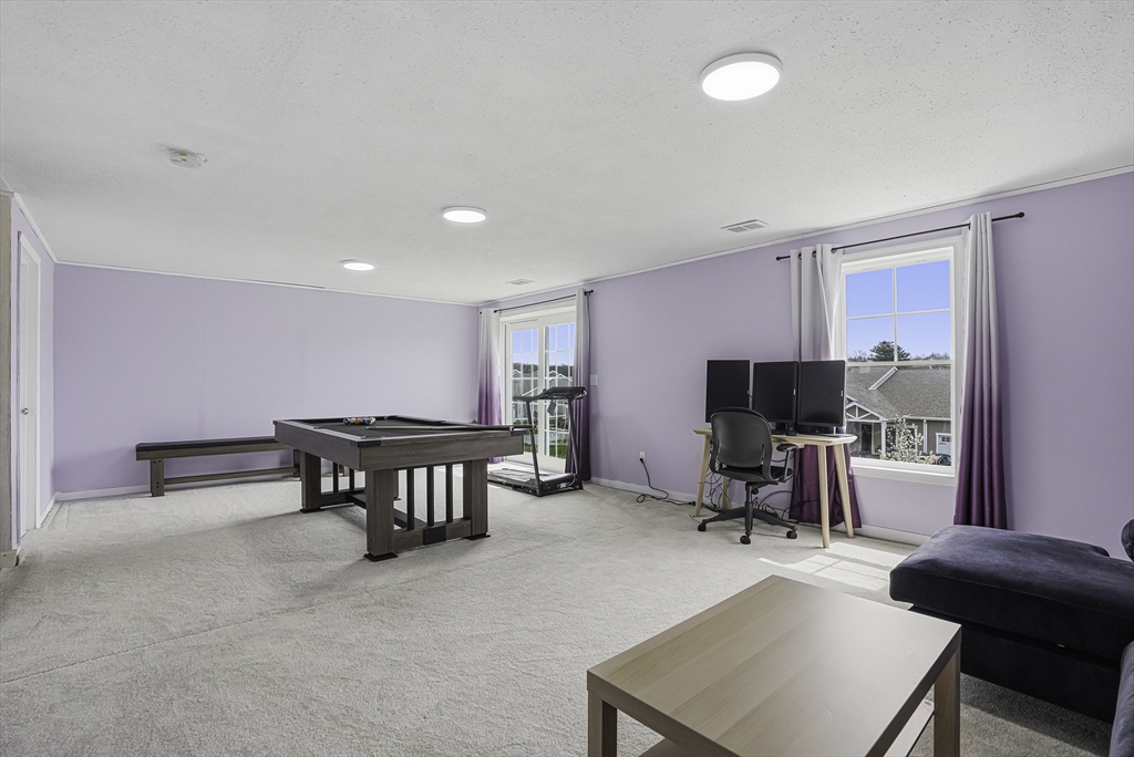 52 Logans Run, Unit 52 Millbury, MA 01527 - Photo 35 of 41 a view of a livingroom with workspace and a couch