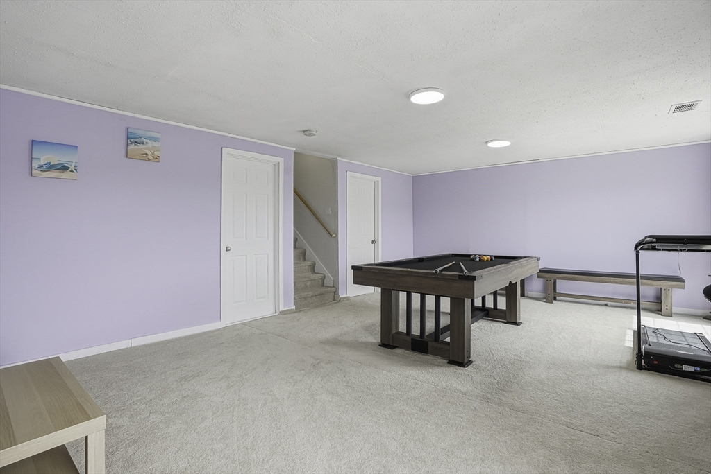 52 Logans Run, Unit 52 Millbury, MA 01527 - Photo 36 of 41 a room with furniture and air hockey table