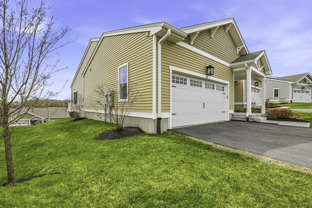52 Logans Run, Unit 52 Millbury, MA 01527 - Photo 40 of 41 a view of a house with a yard