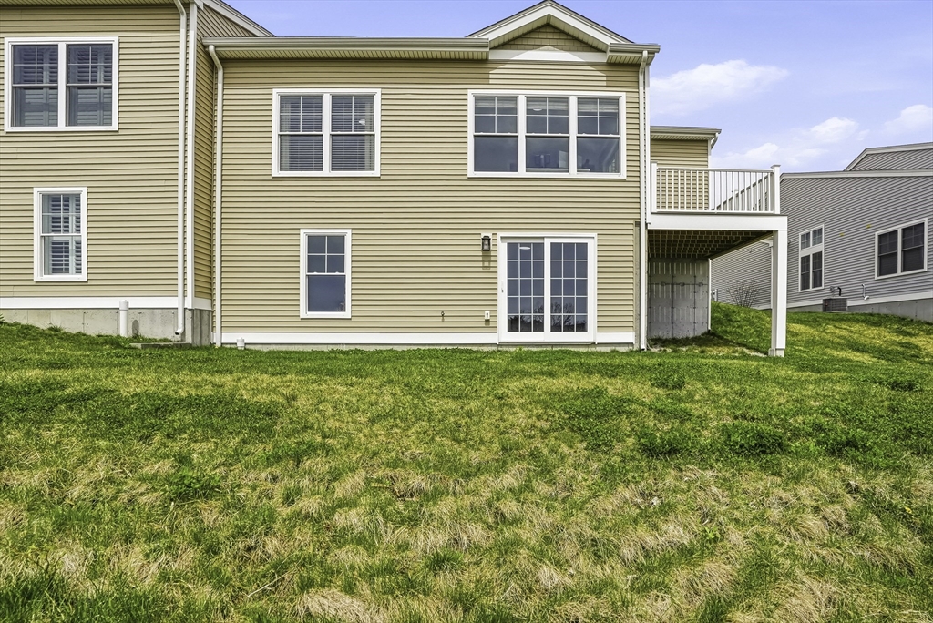 52 Logans Run, Unit 52 Millbury, MA 01527 - Photo 41 of 41 a front view of a house with a yard