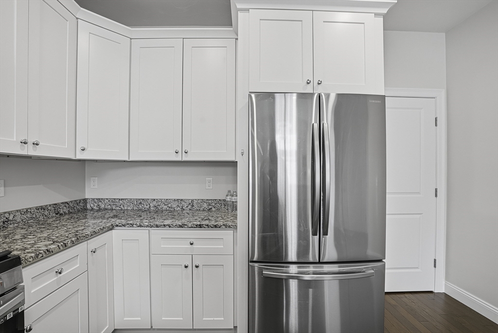 52 Logans Run, Unit 52 Millbury, MA 01527 - Photo 6 of 41 a kitchen with appliances and cabinets