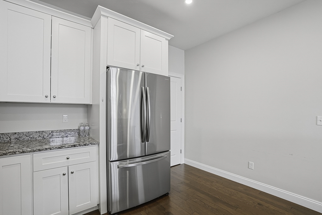 52 Logans Run, Unit 52 Millbury, MA 01527 - Photo 7 of 41 a white refrigerator freezer sitting inside of a kitchen