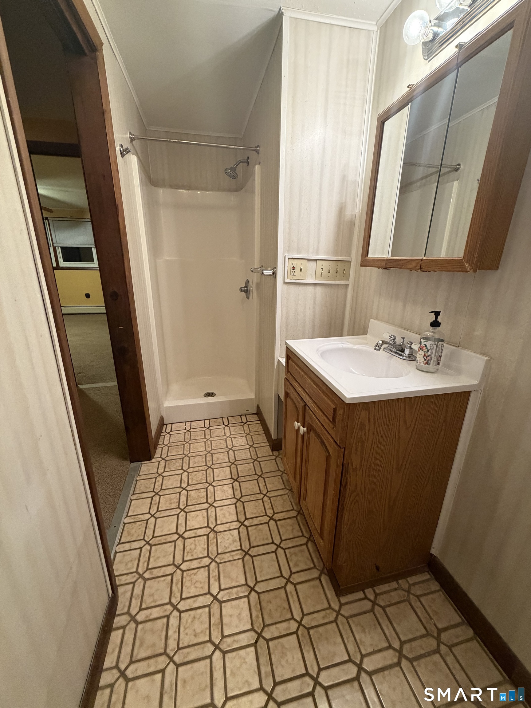 19 Evergreen Drive Clinton, CT 06413 - Photo 15 of 30 a bathroom with a sink a mirror and shower