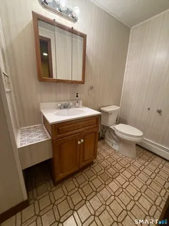 a bathroom with a sink a mirror and shower