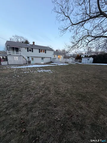 a view of a yard with a tree