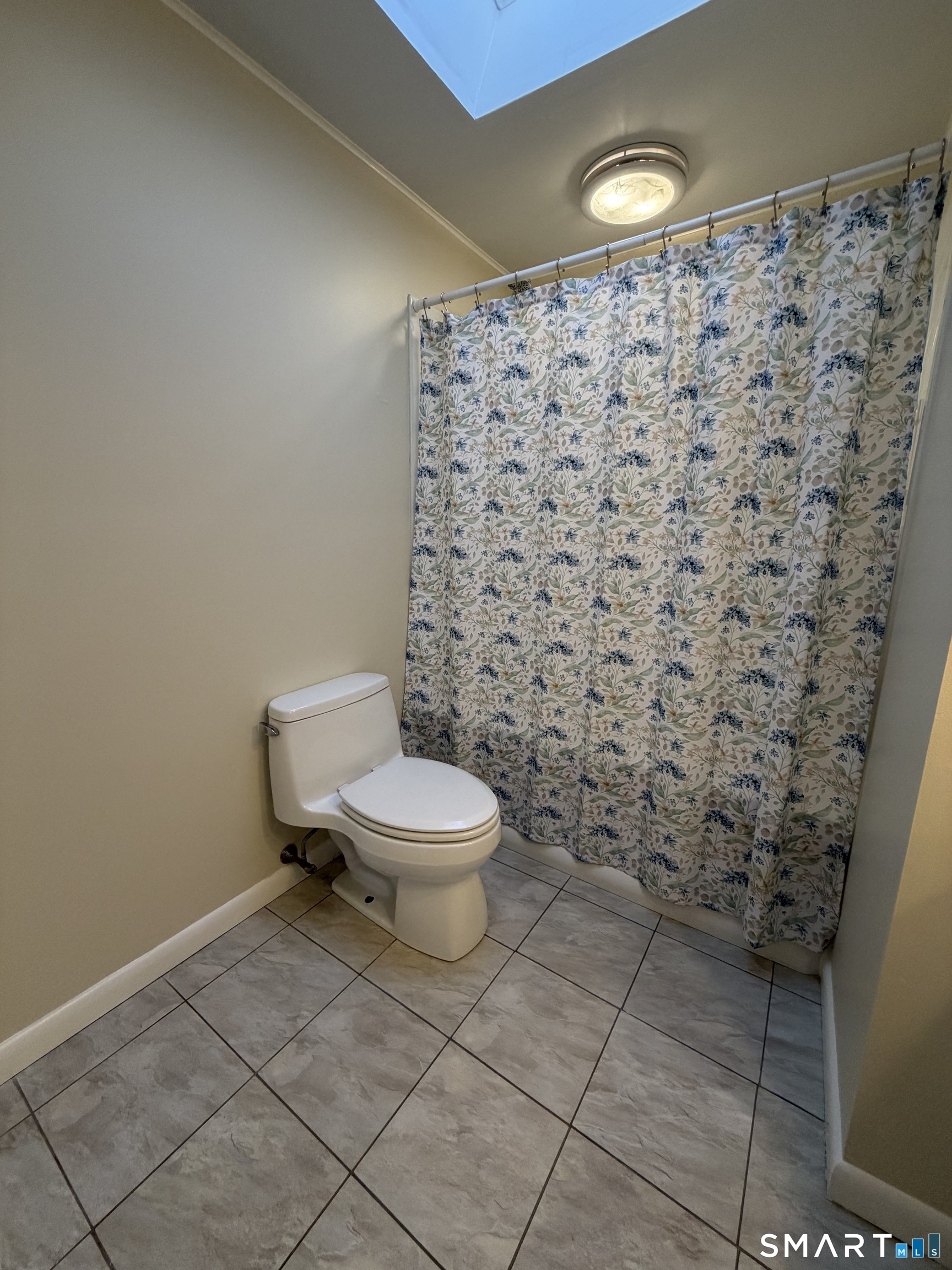 19 Evergreen Drive Clinton, CT 06413 - Photo 4 of 30 a white toilet sitting next to a shower curtain