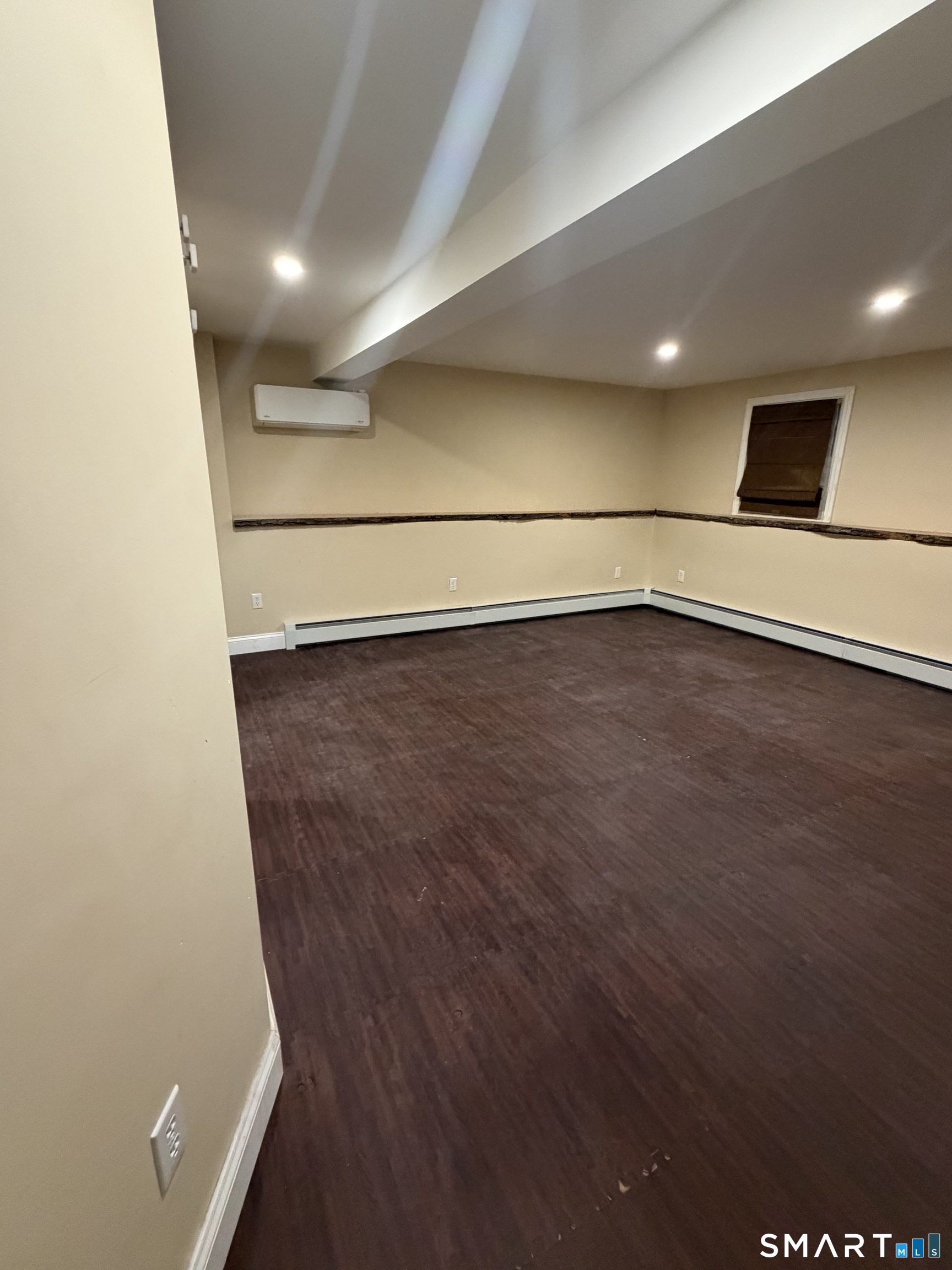 19 Evergreen Drive Clinton, CT 06413 - Photo 9 of 30 an empty room with wooden floor and white walls