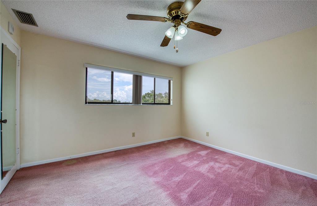 700 Starkey Road, Unit 1145 Largo, FL 33771 - Photo 35 of 63 an empty room with a window and a fan