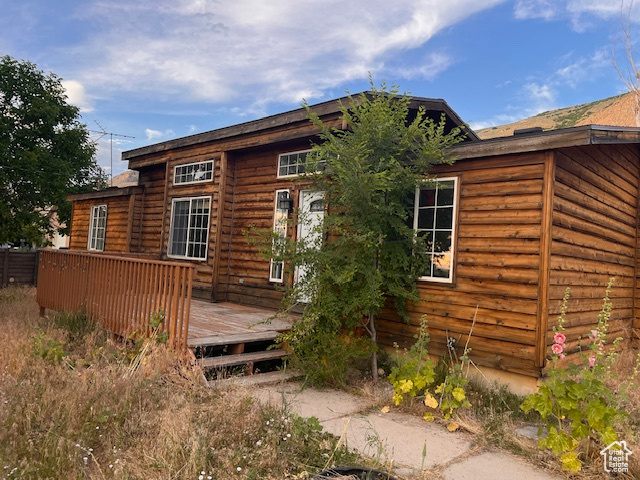 Undisclosed Address Willard, UT 84340 - Photo 1 of 1 Rear view of property featuring a wooden deck