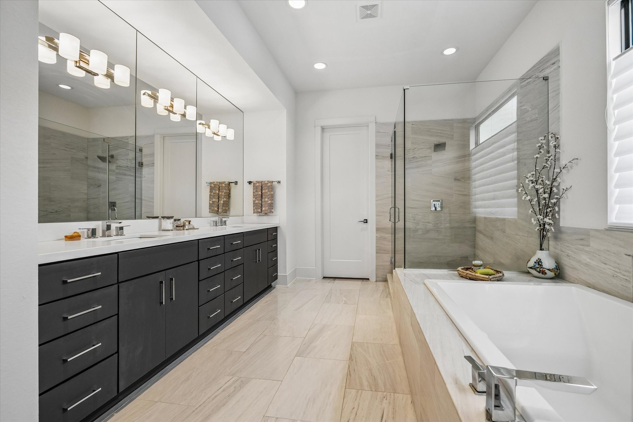 1526 Vermont Street Houston, TX 77006 - Photo 32 of 39 Another view of the primary bath showcasing the expansive vanity, excellent storage, and elegant modern design.