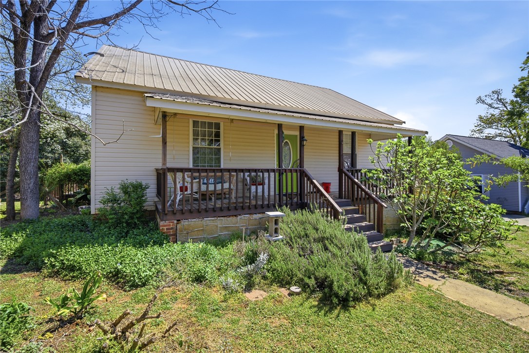 This inviting home offers a welcoming facade with a charming porch.