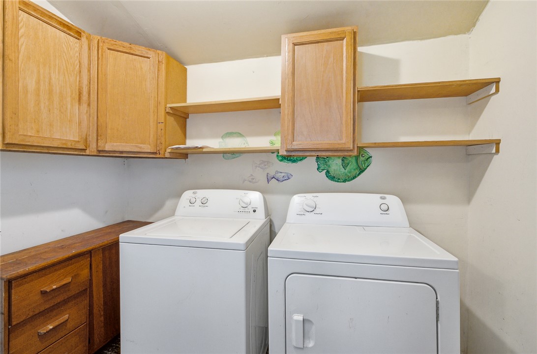 618 Aiken Street Calhoun Falls, SC 29628 - Photo 12 of 21 This functional laundry room offers convenient appliances and ample storage space.