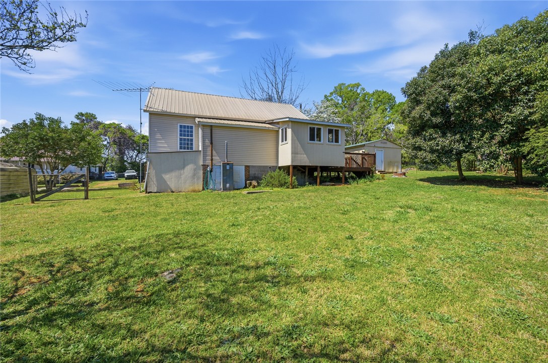 618 Aiken Street Calhoun Falls, SC 29628 - Photo 15 of 21 This property features a spacious yard and an elevated deck for outdoor enjoyment.