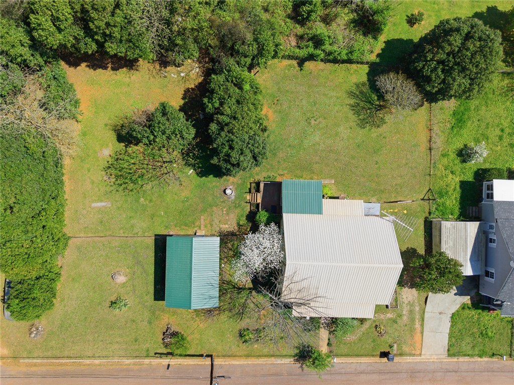 618 Aiken Street Calhoun Falls, SC 29628 - Photo 19 of 21 This expansive property offers a private yard with lush greenery and ample space for outdoor living.