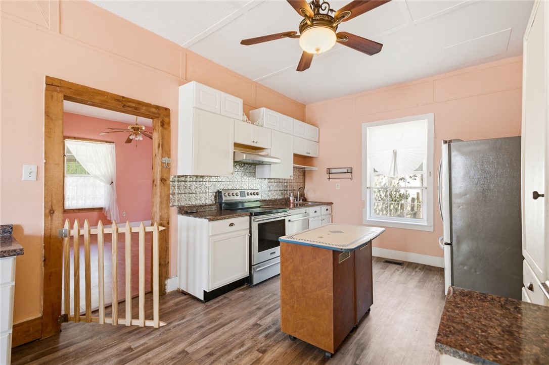 618 Aiken Street Calhoun Falls, SC 29628 - Photo 2 of 21 This spacious kitchen offers ample room for culinary endeavors and entertaining.
