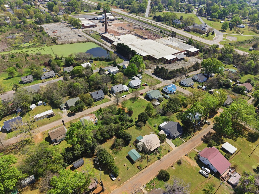 618 Aiken Street Calhoun Falls, SC 29628 - Photo 21 of 21 An aerial view captures the vibrant neighborhood, revealing the landscape and surrounding areas.