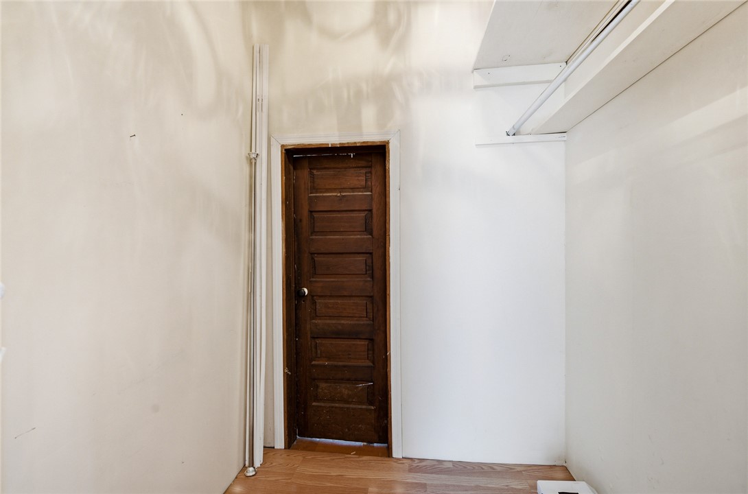 618 Aiken Street Calhoun Falls, SC 29628 - Photo 8 of 21 This closet features warm wood flooring and convenient built-in shelving, optimizing storage.