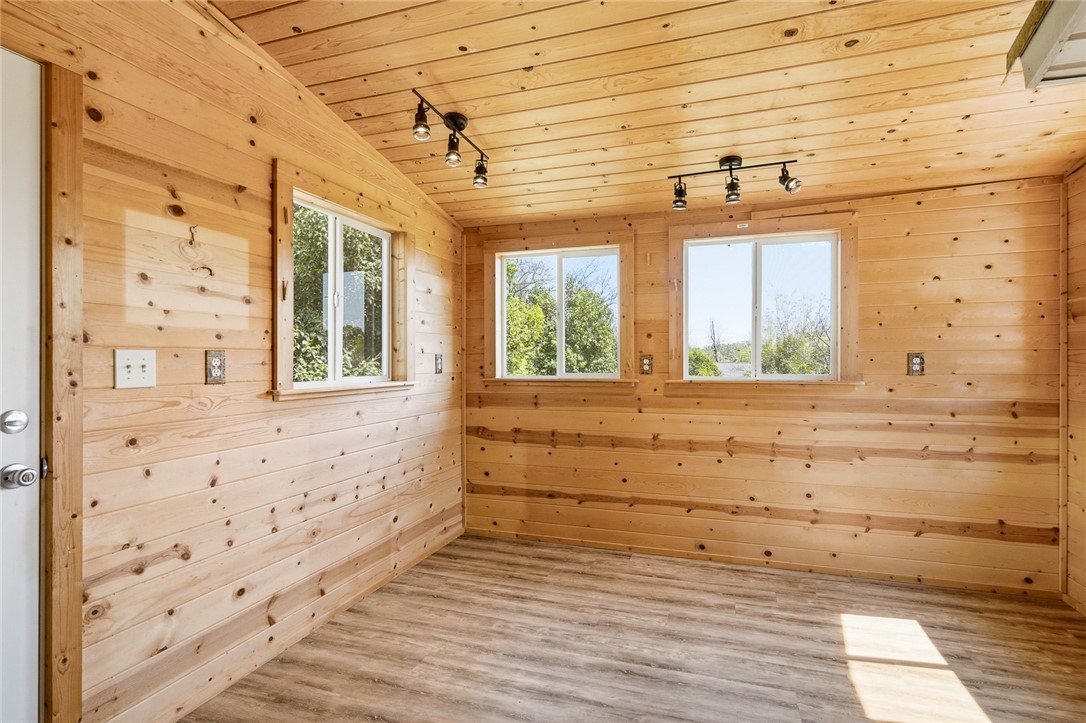 618 Aiken Street Calhoun Falls, SC 29628 - Photo 9 of 21 This bright space features natural wood walls and durable flooring, perfect for a versatile room.