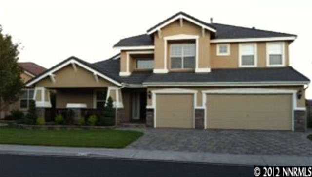 1540 Diamond Country Drive Reno, NV 89521 - Photo 1 of 1 a front view of a house with a yard and garage