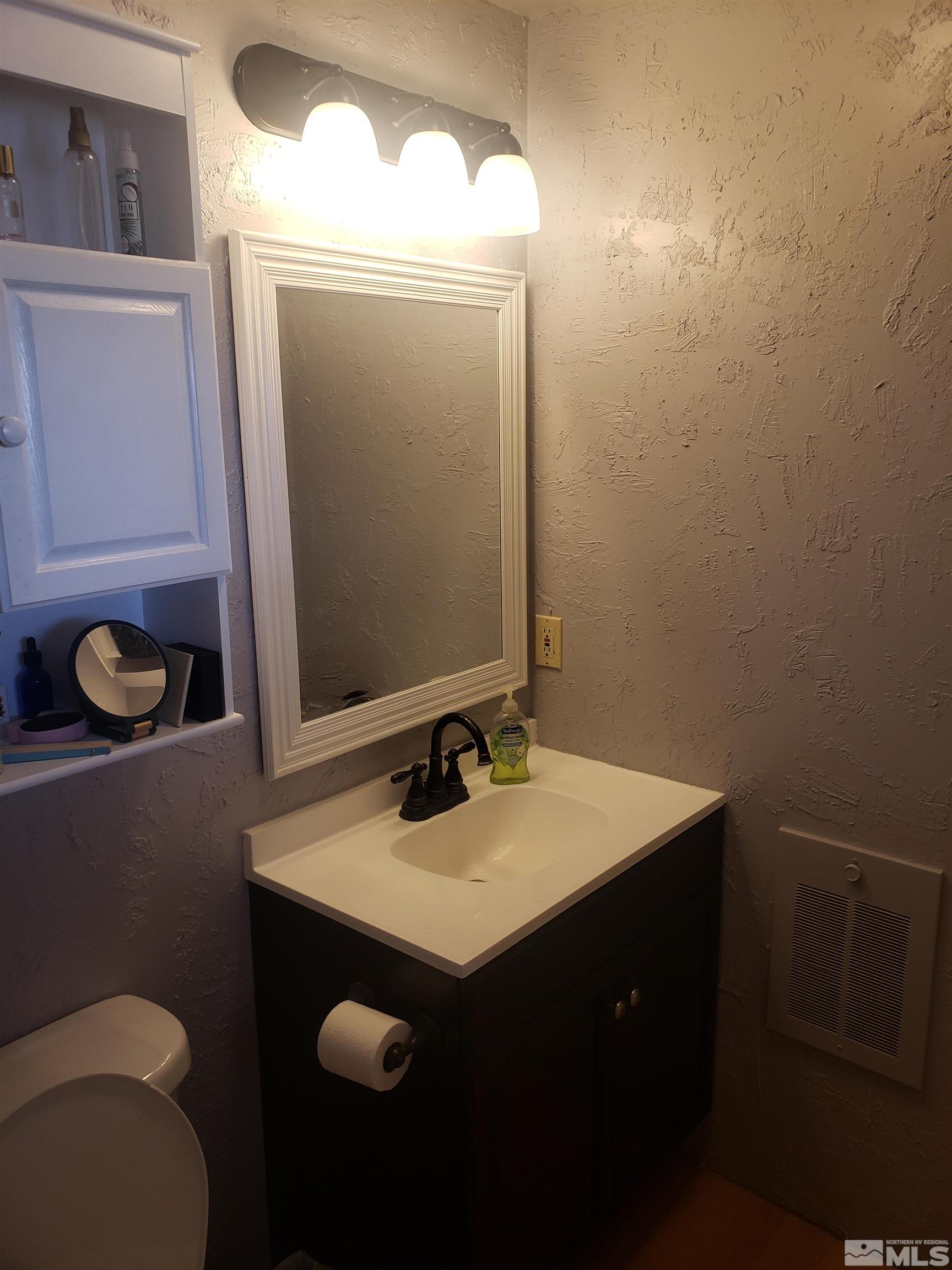 4044 Schurz Highway Fallon, NV 89406 - Photo 11 of 29 a bathroom with a sink vanity and toilet