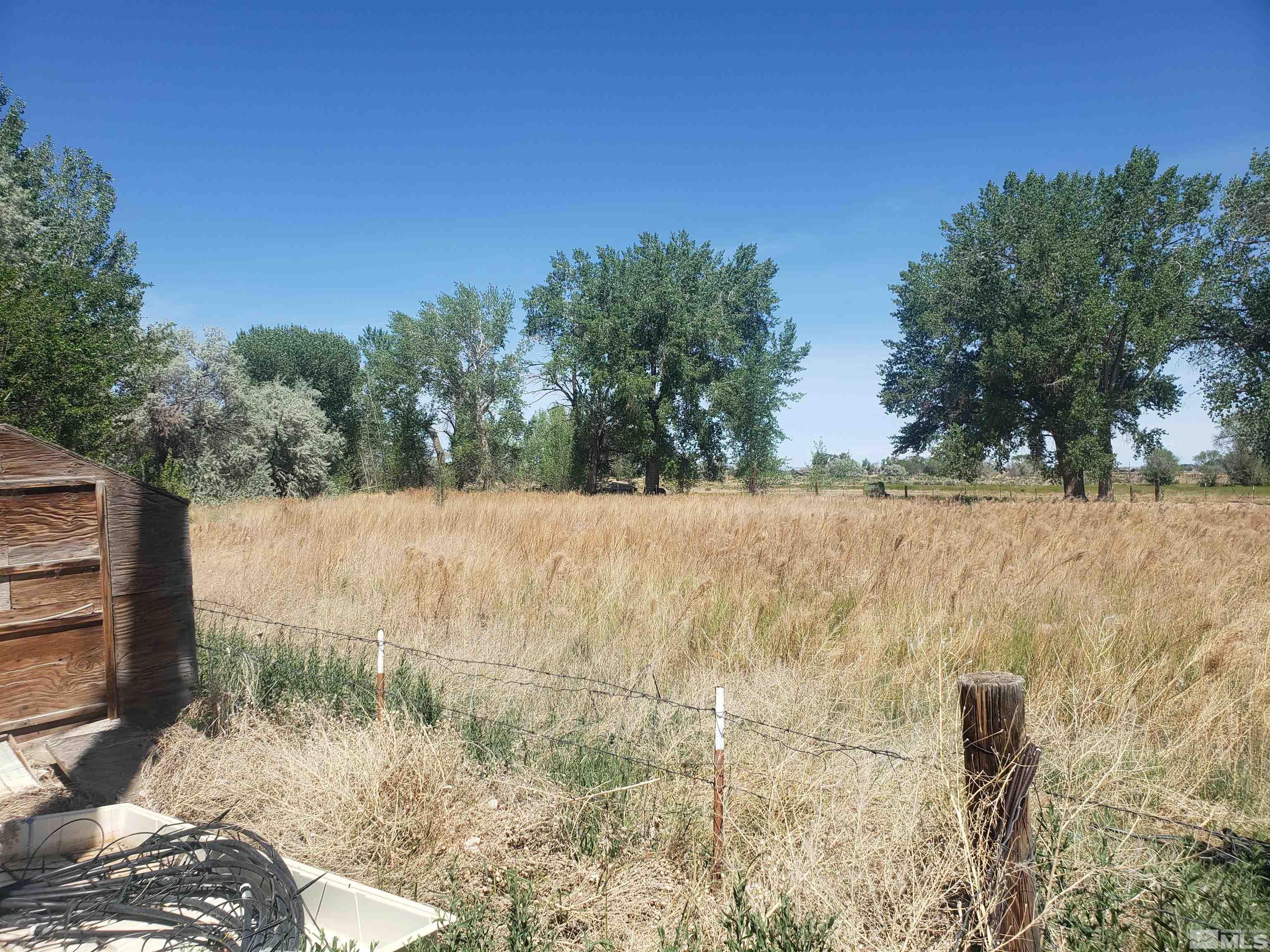 4044 Schurz Highway Fallon, NV 89406 - Photo 26 of 29 a view of a yard covered with snow in front of house