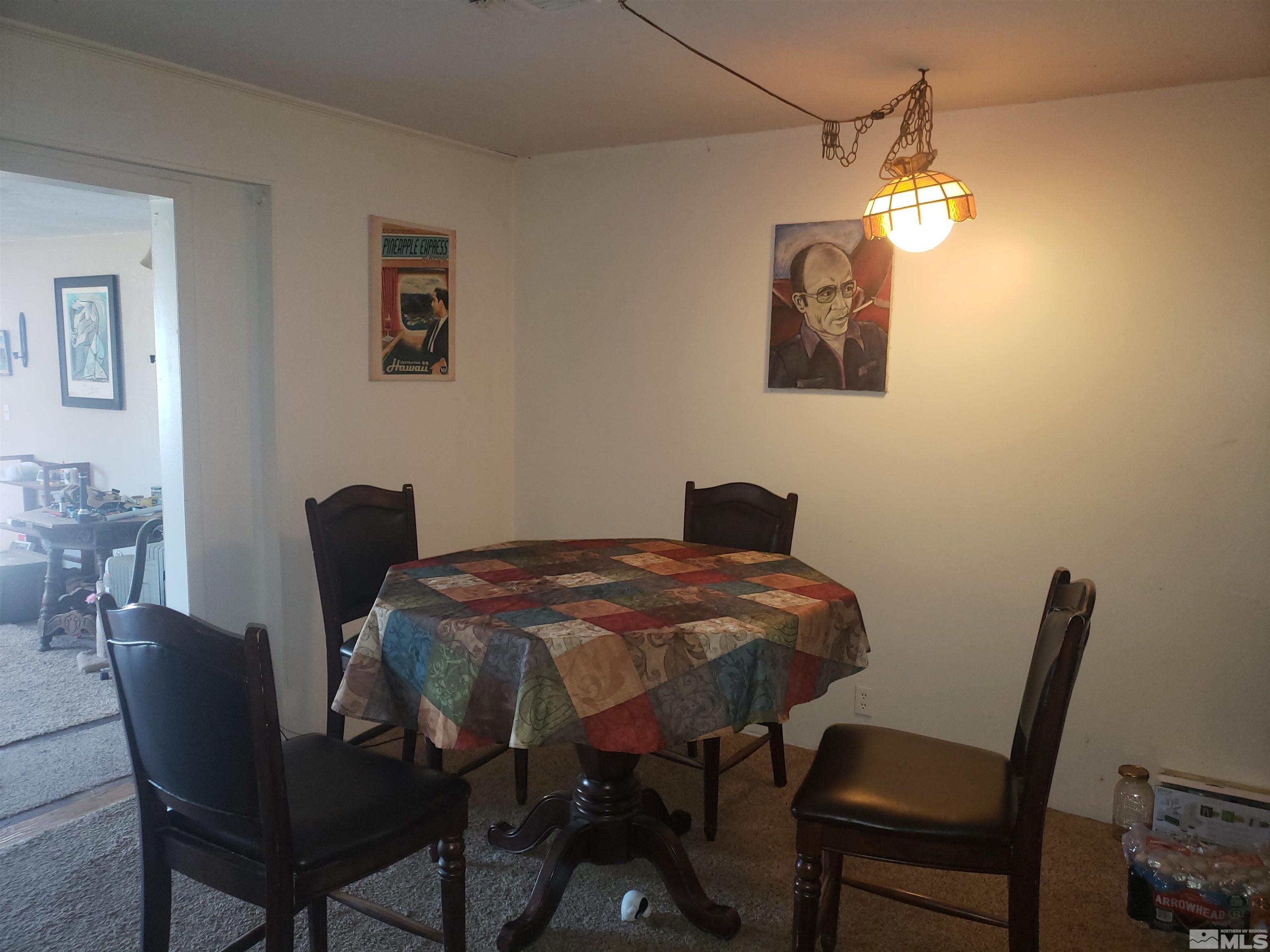 4044 Schurz Highway Fallon, NV 89406 - Photo 7 of 29 a view of a dining room with furniture and chandelier