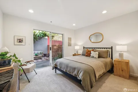 a bedroom with a bed and a table