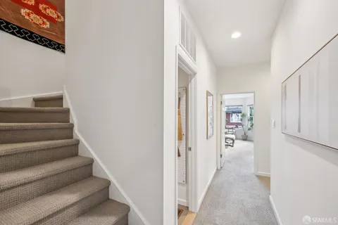 a bedroom with a bed and glass window