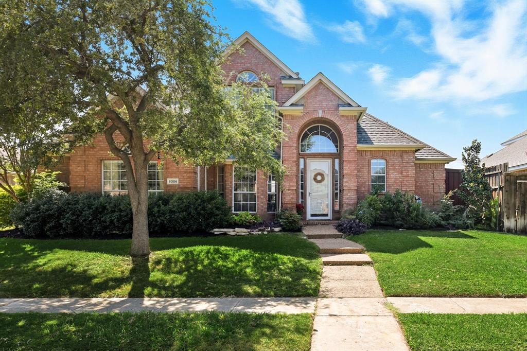 6306 Day Spring Drive The Colony, TX 75056 - Photo 1 of 1 a front view of a house with a yard