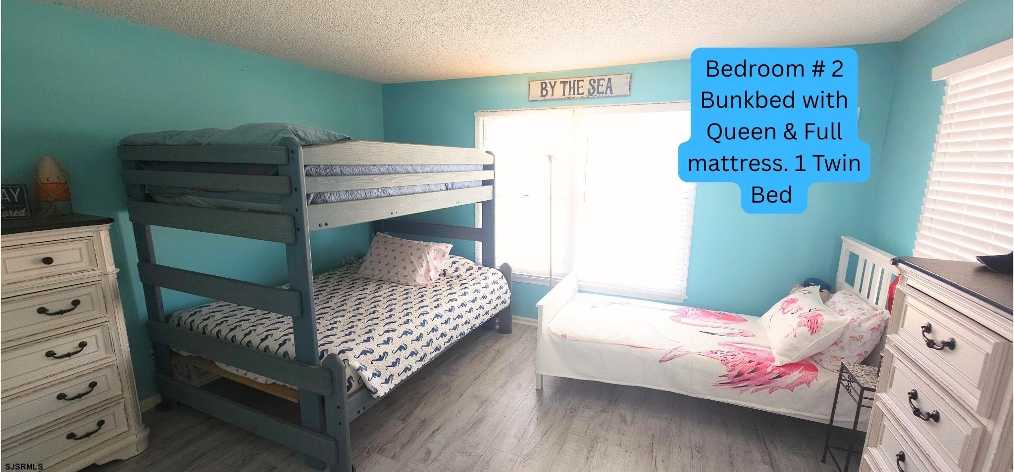 322 38th Street South, Unit B Brigantine, NJ 08203 - Photo 5 of 21 a bedroom with a bed and a dresser